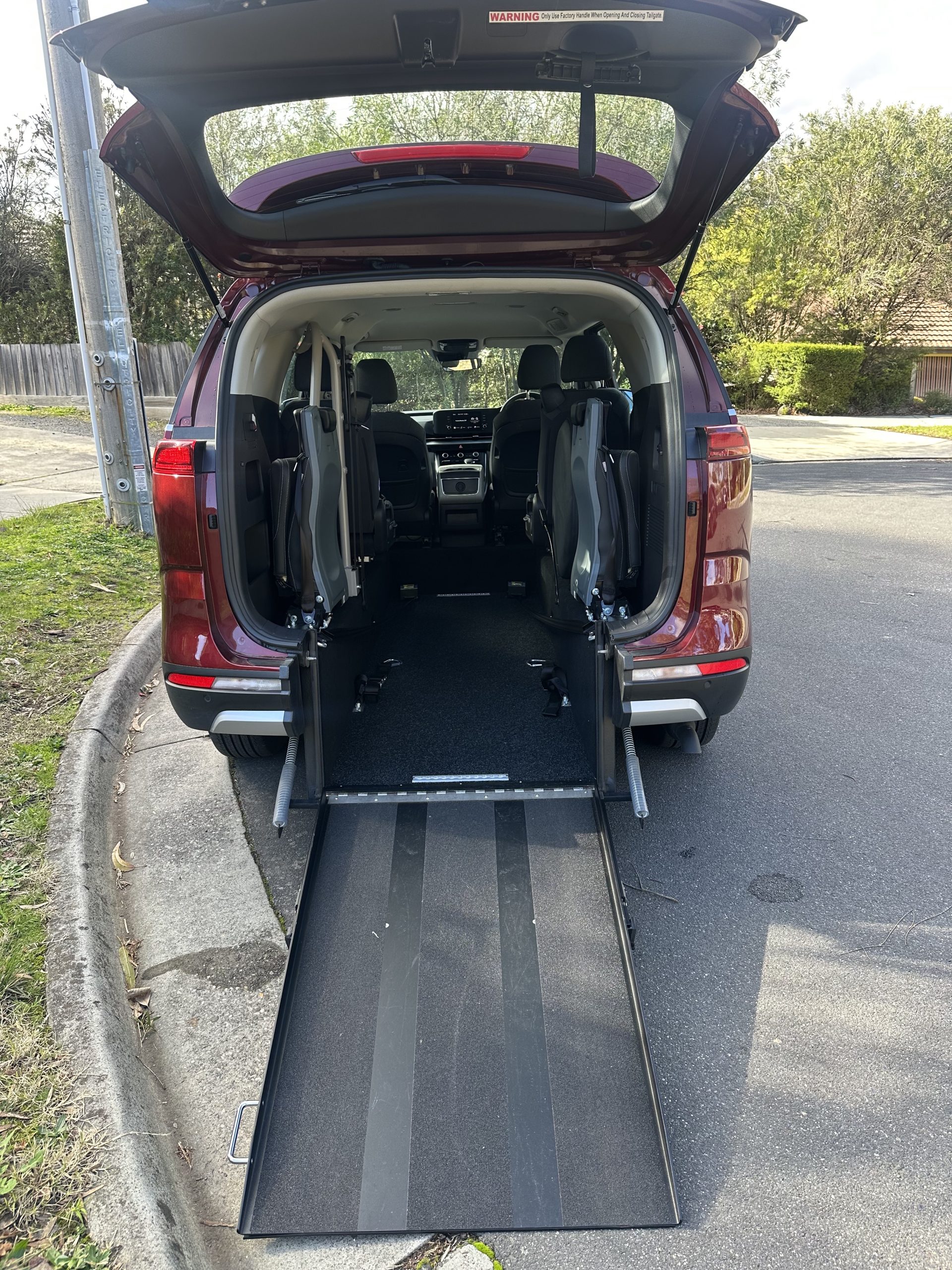 2nd row Kia Carnival wheelchair accessible vehicle photo 3